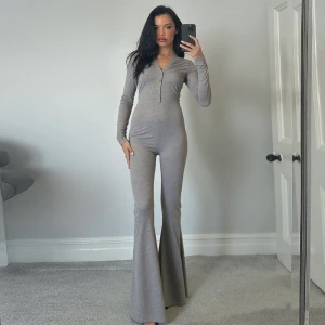 Autumn Solid Color V Neck Button Tight Long Sleeve High Waist Micro Pull Jumpsuit